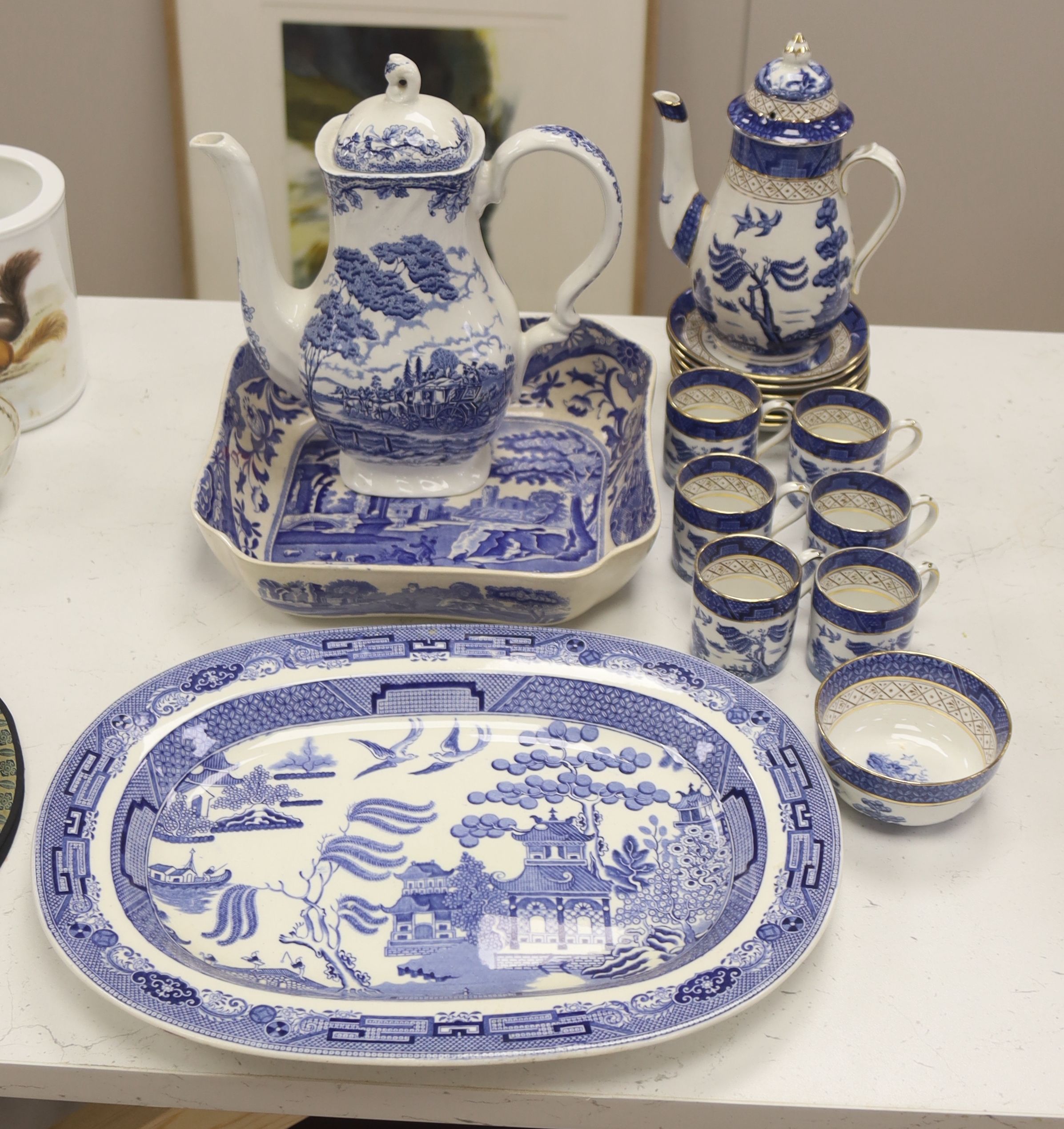 A Wedgwood blue and white willow pattern meat dish, a Copeland Spode Tower pattern square shaped bowl & a blue and white coffee pot (3)